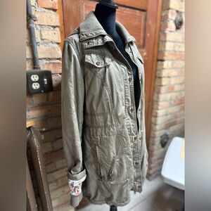 Women’s fashionable casual warm jacket. Made by “Ms. Top Gun”.